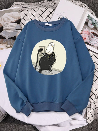 a blue funny cat sweatshirts with a picture of pigeon chilling on a cat comes in multiple colors