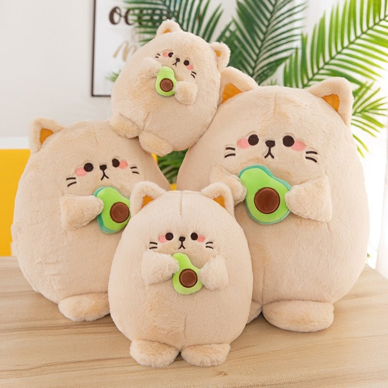 a kawaii look japanese plush of a cat holding avocado