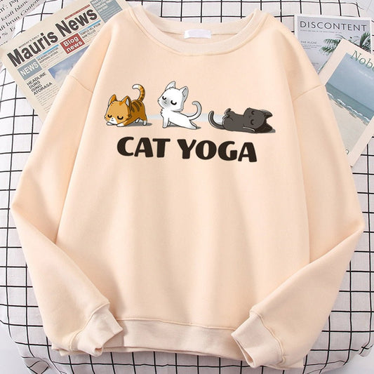 a biege color womens cat sweatshirt with pictures of cats doing yoga