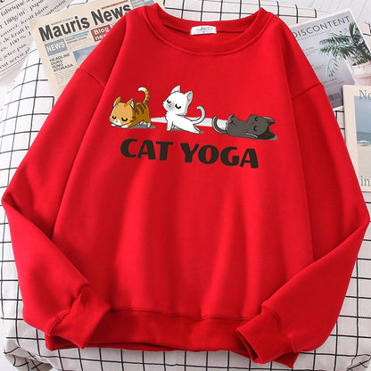 a red color cat sweaters for humans with pictures of cats doing yoga