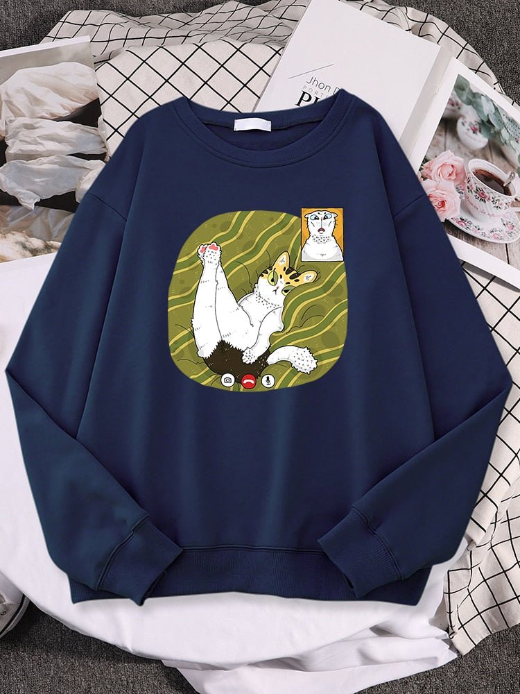 a navy blue cat print sweatshirt with a picture of two cats having a facetime call