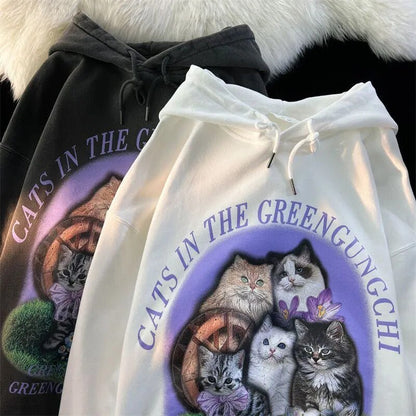 Five distinct cats surrounded by blue and lavender flowers on hoodie