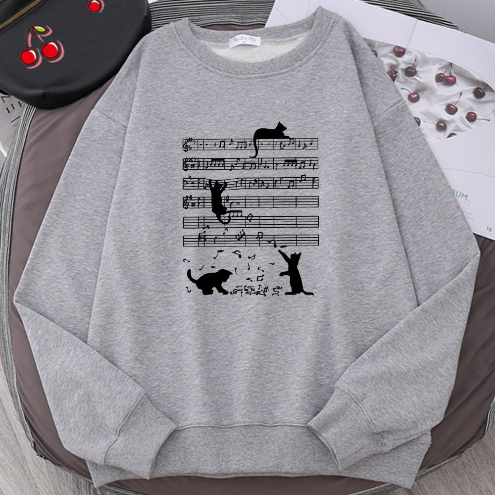 gray color kitty sweatshirt with cats playing with music notes