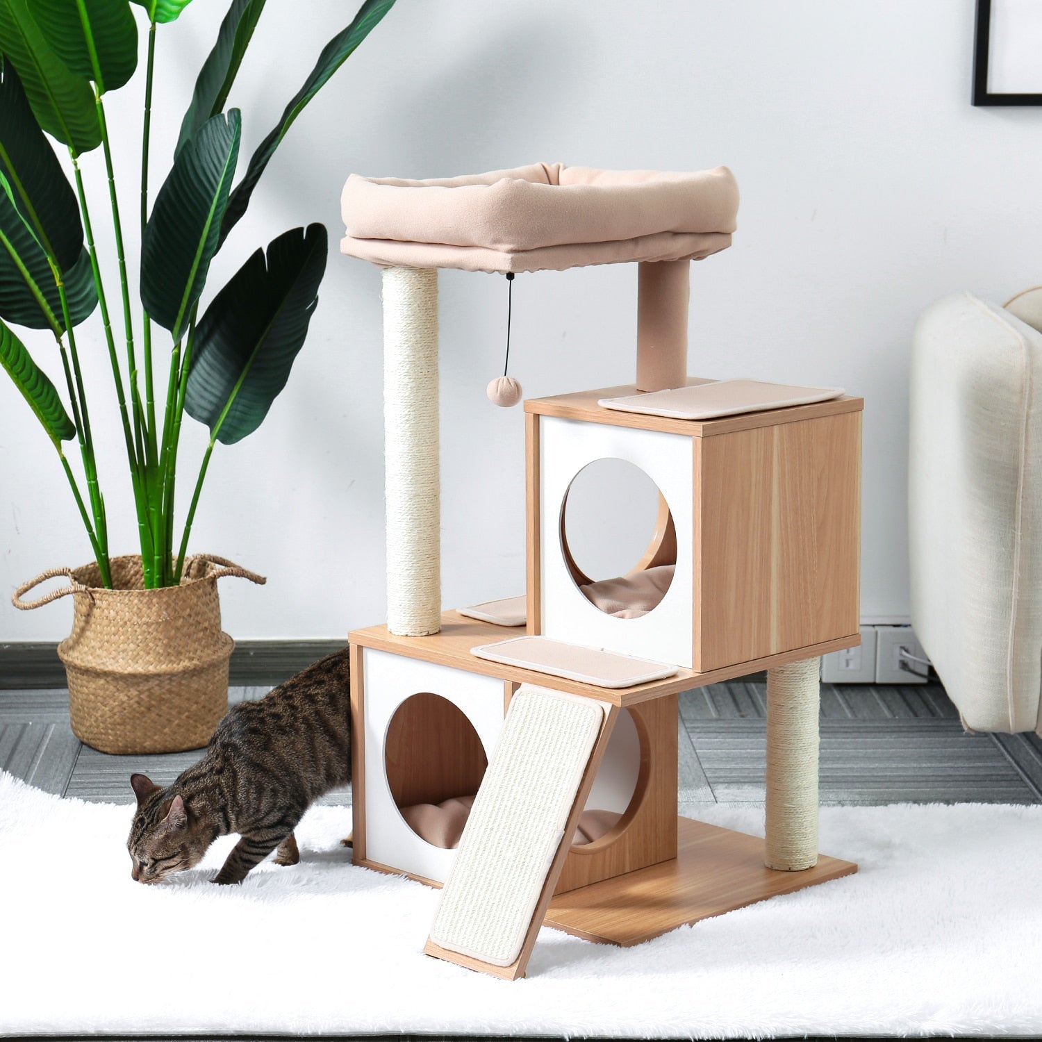 a biege color modern cat tree tower with interactive toys