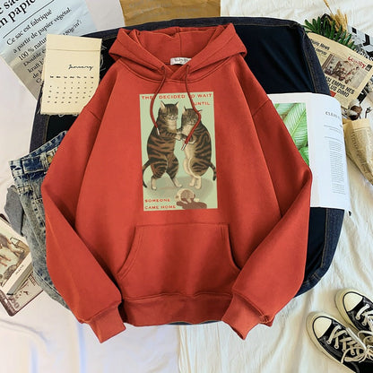 brick red hoodie with a picture of cats spilling milk
