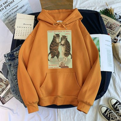orange color hoodie made for women with a funny and cute message of cats do not want to be blamed for spilled coffee