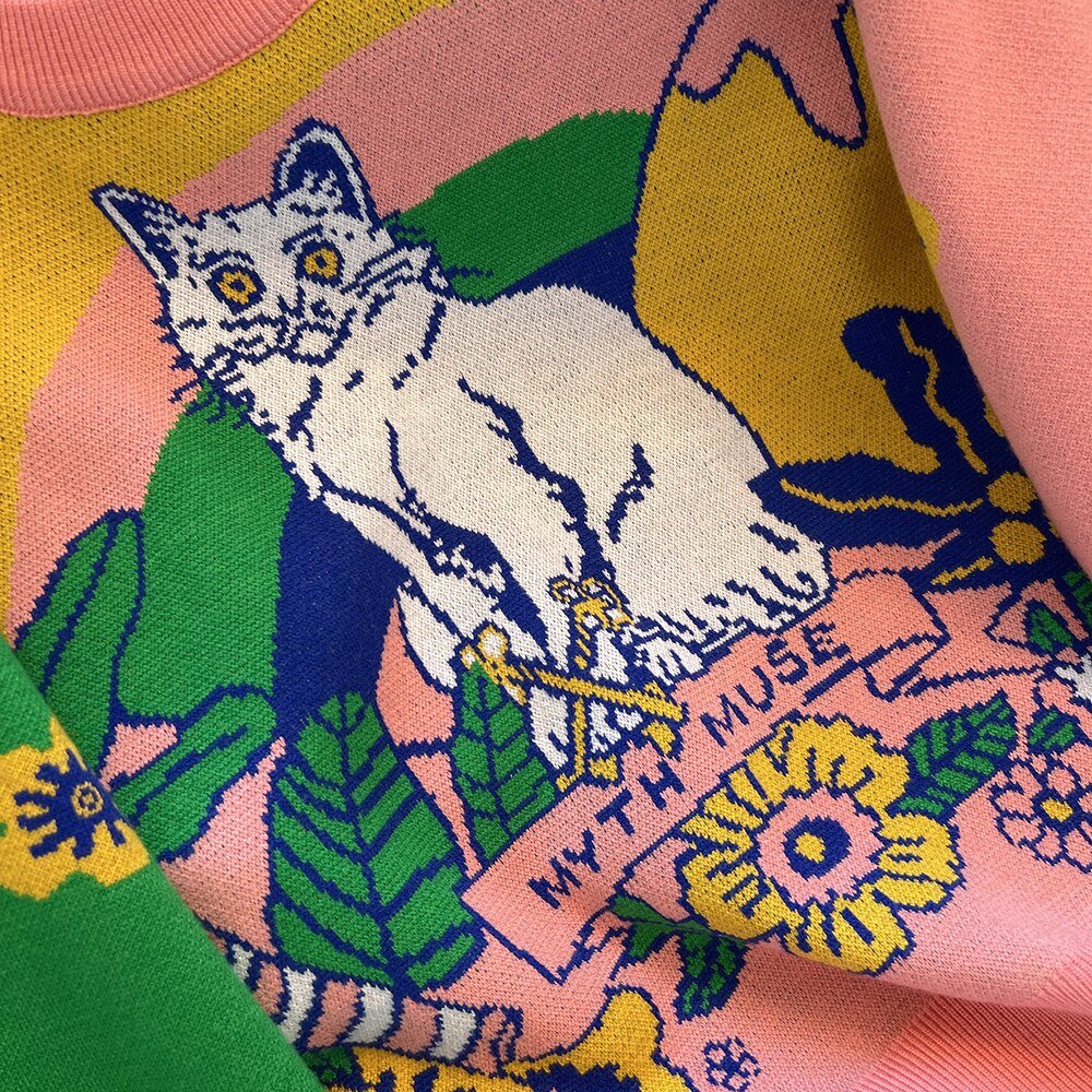 a close up of a cat sweater for woman with cute cat illustration