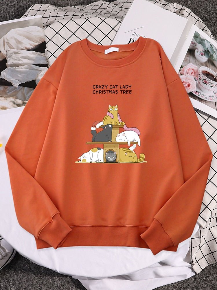 an orange womens cat sweatshirts for christmas season with cats on cat tower design