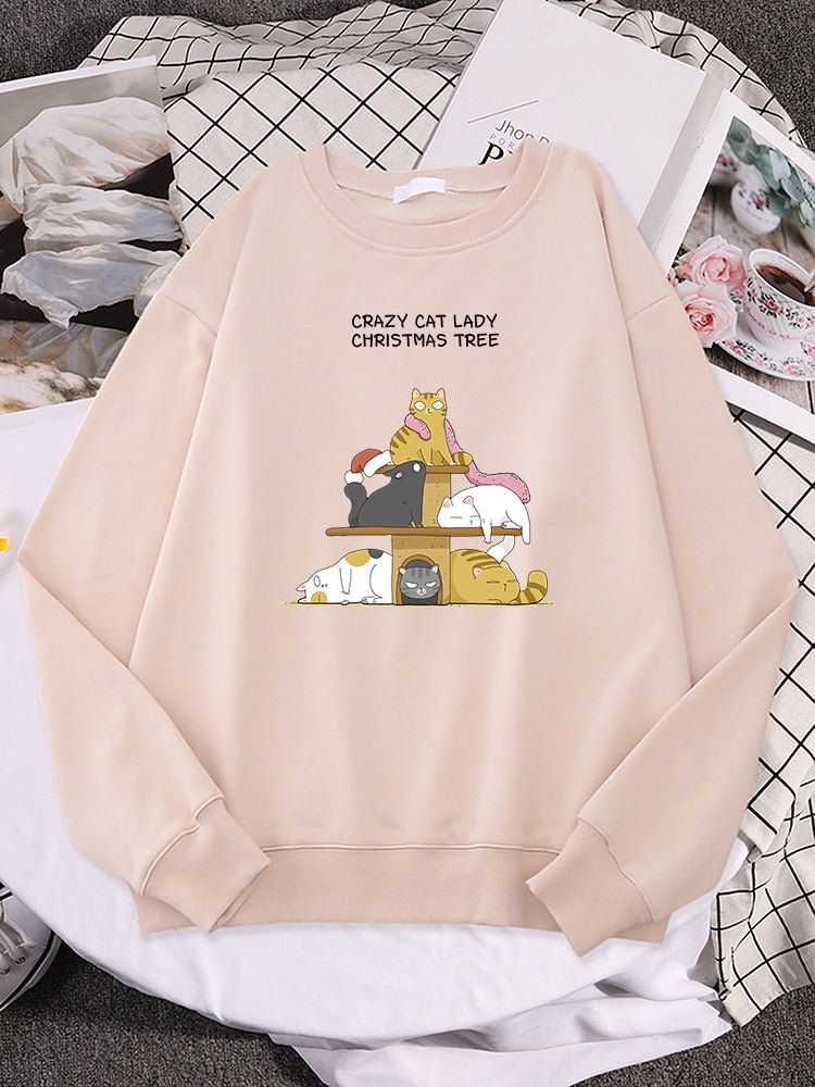a biege color cat sweater for ladies with crazy cat on a cat tower designs