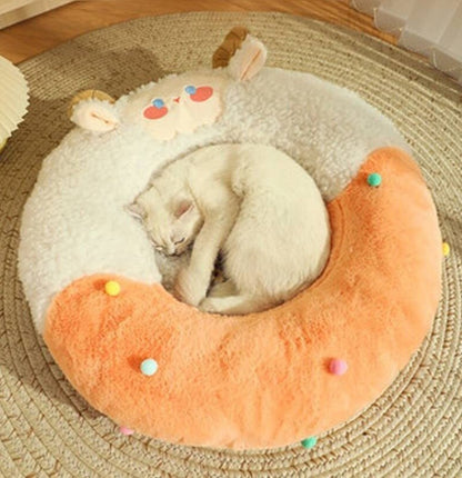 cat cuddling on a cat bed that looks modern and comfortable