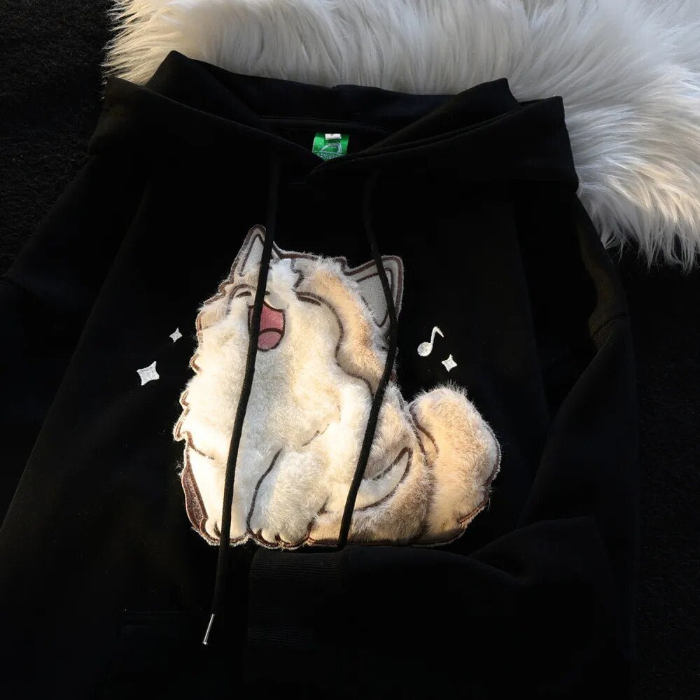 Cute singing cat with music notes on black hoodie