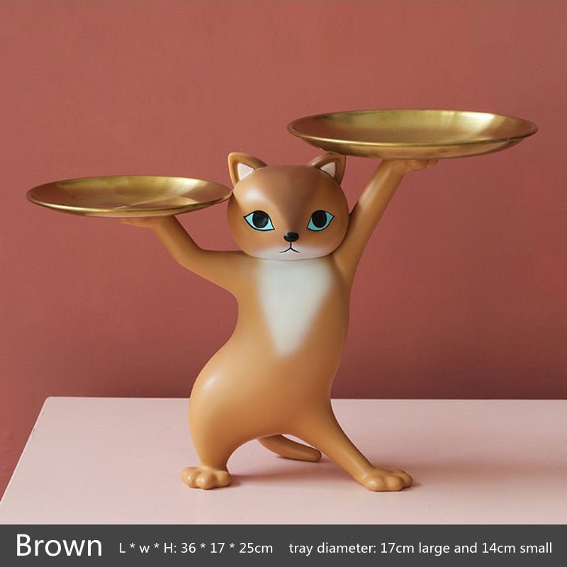 an orange cat sculpture holding 2 trays in dancing pose
