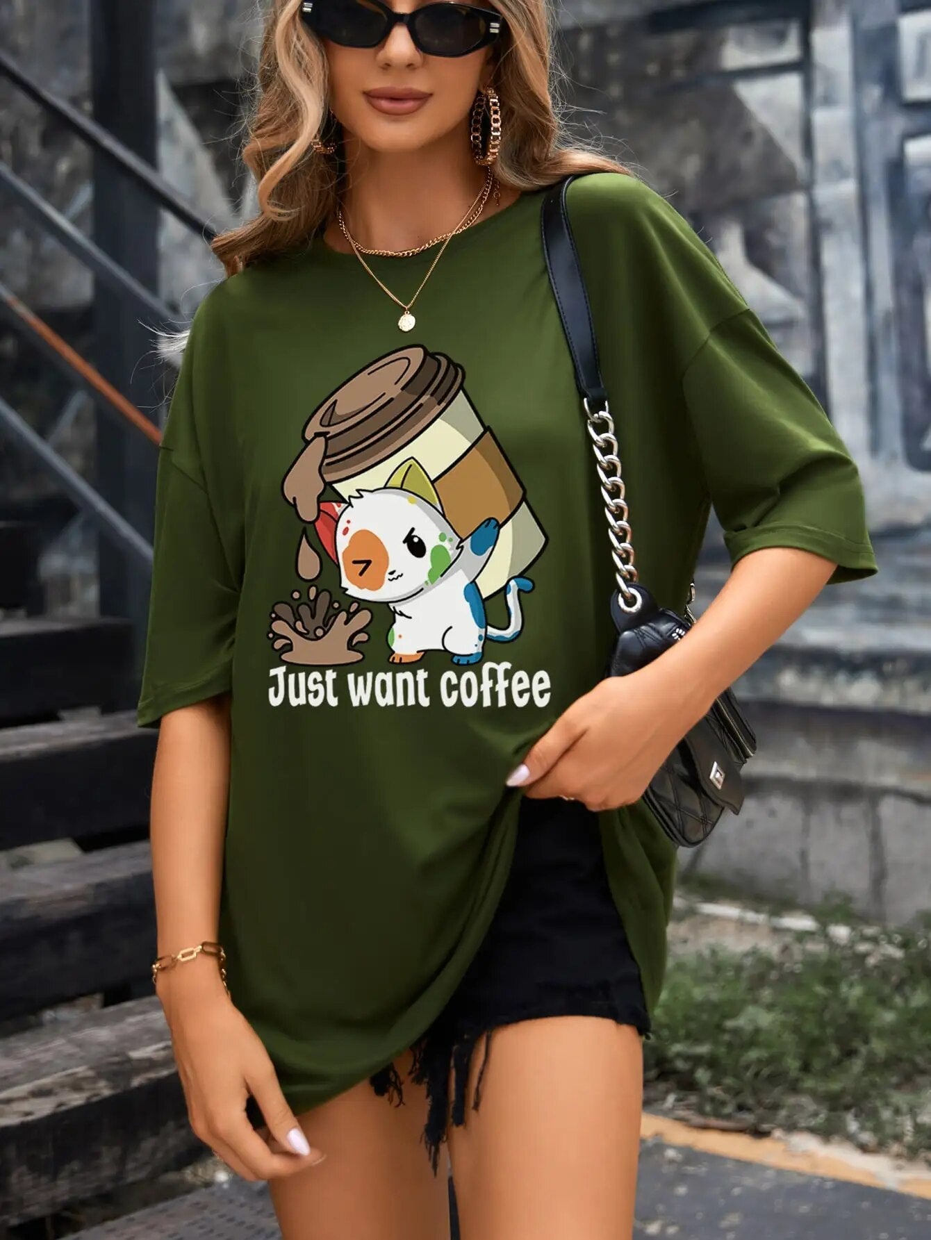 Vibrant and fun coffee cat graphic on rich dark green tee