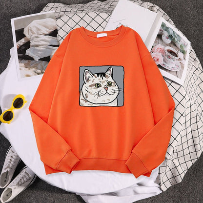 an orange cat themed sweatshirts with a cat meme picture on it