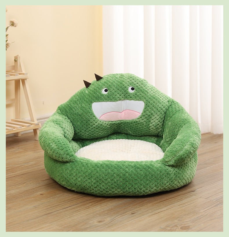 a green color cat bed with the shape like a cute monster hugging the bed which gives calming effect for cats