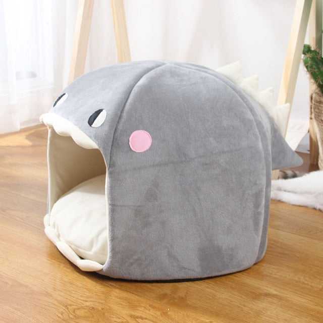 grey color dinosaur style cat bed that comes with a cushion that is comfortable for pets