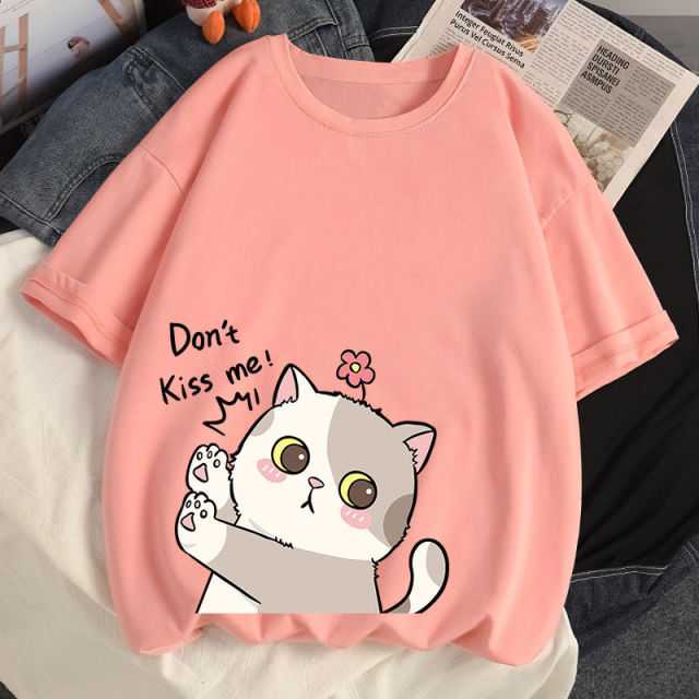 a pink color cotton t shirt featuring a cute calico cat cartoon kiss me