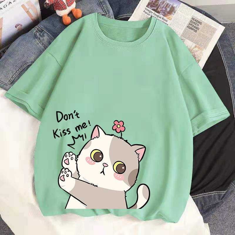 green color cat woman t shirt showing a cat refusing people to kiss him