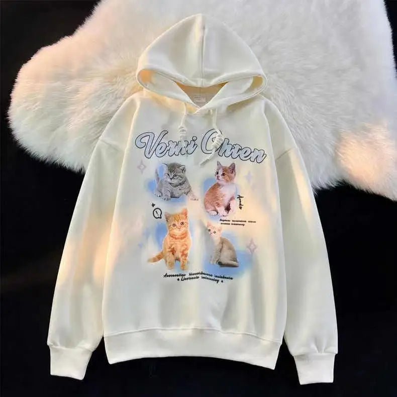 Whimsical and cute design of cats and stars on a cozy hoodie.