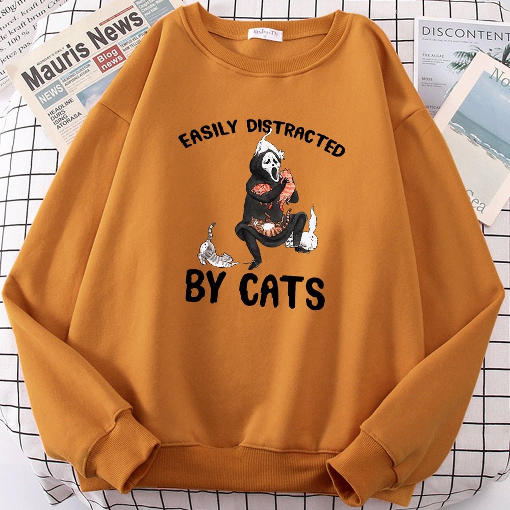an orange color halloween cat sweatshirt with picture of ghost playing with cats