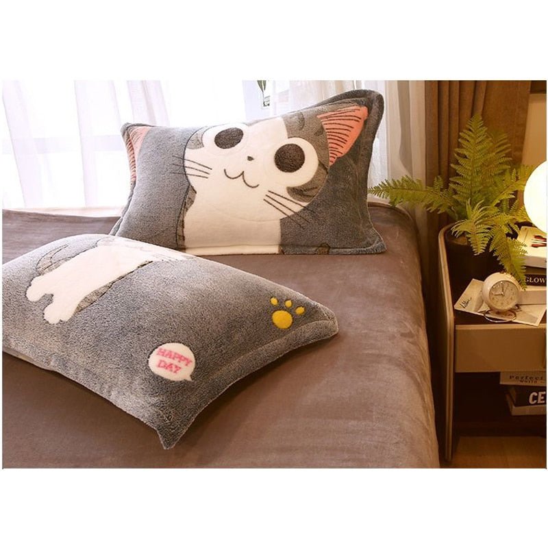 a pillow case with a very cute big eyes gray cat