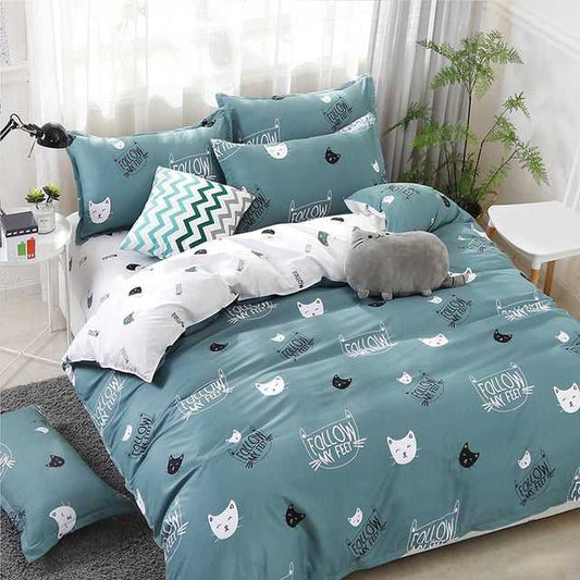 turquoise color cat bedding set with cute white and black cat faces on it made for cat lovers
