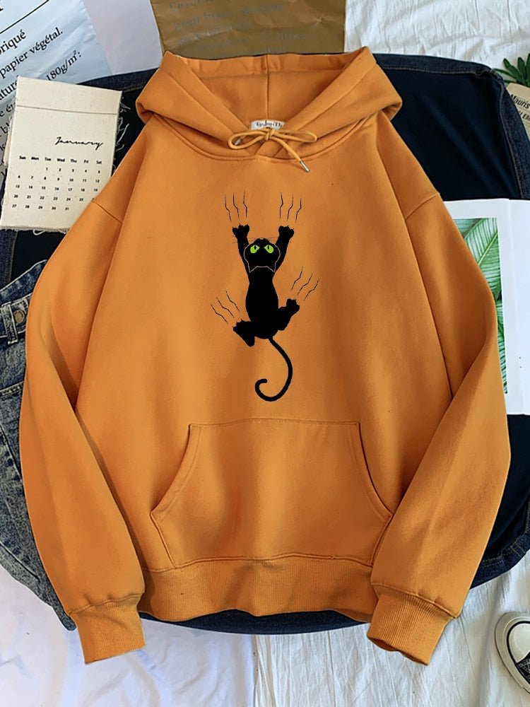 khaki color cat hoodie that looks cool with an illustration of a cat climbing