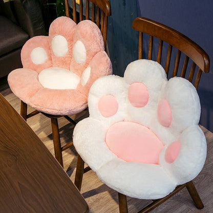 pink and white color fluffy chair cushion in a cat paw shape that looks so kawaii