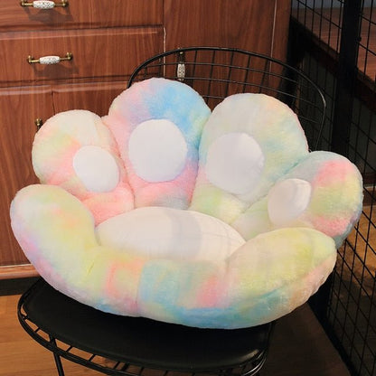 rainbow color cat paw cushion that is so fluffy and suitable to put on a chair for maximum comfort