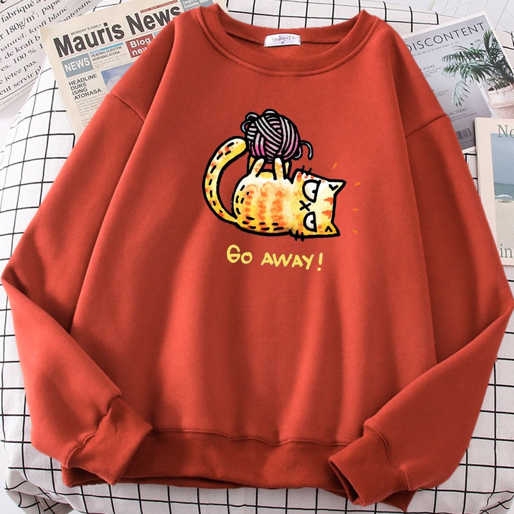 a red color sweatshirt with grumpy cat playing with yarn ball