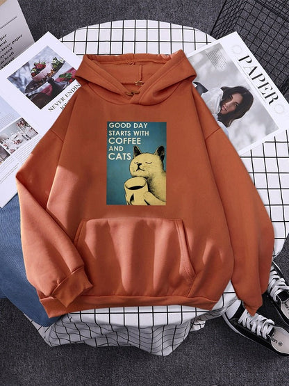 orange color hoodie with printed cat and coffee on it