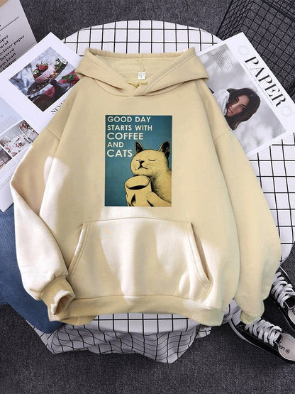 beige color womens cat hoodie with a picture of a cat taking a sip of coffee in the morning