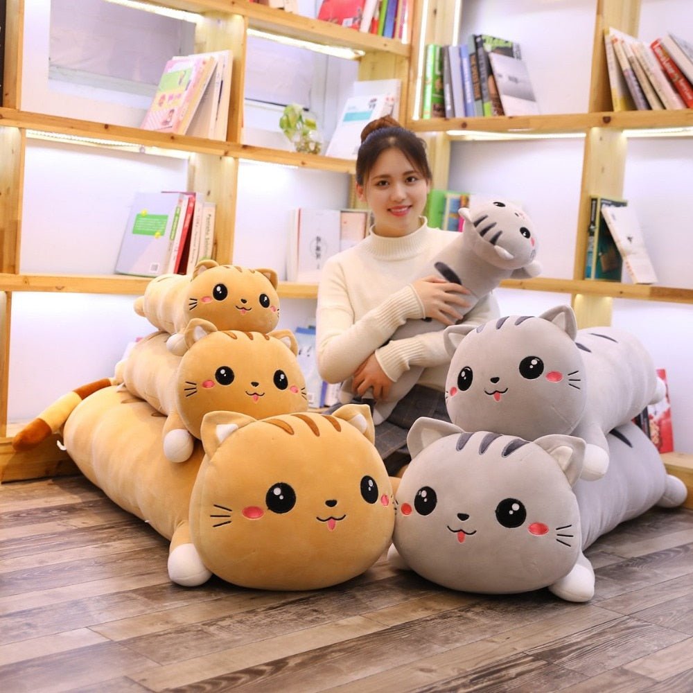 a lady is hugging a long cat plushy from different sizes