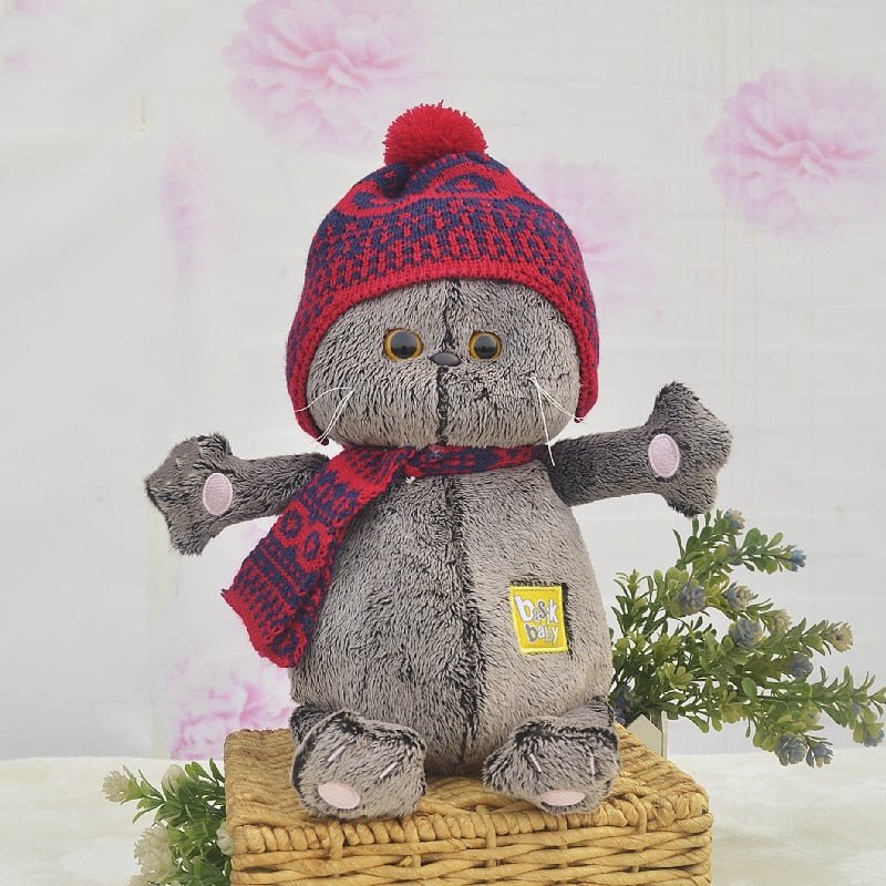 a cute plushies of a scottish fold wearing a beanie and scarf