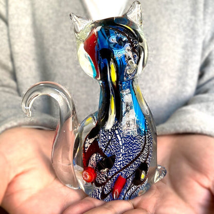 an artistic masterpiece of a glass cat statue with vibrant blue color for modern home decor