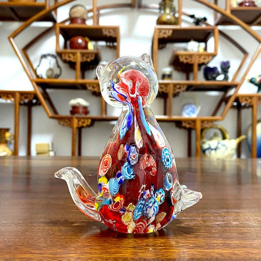 a unique and limited edition handblown cat sculpture for luxury home decor in vibrant red color