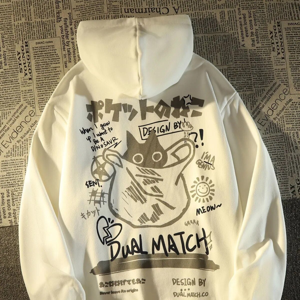 Hand-drawn graphics on a hoodie with doodles and a central black cat design