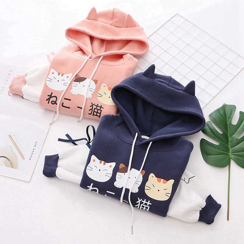 a pair of hoodie made for couple with cute cat designs in japanese style