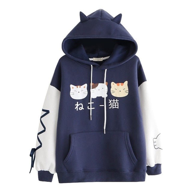 a navy blue hoodie with a calico cat design and two other cats on it
