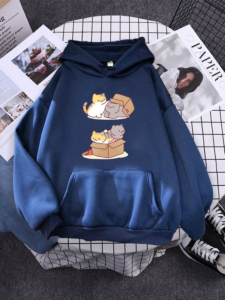 a blue color cat hoodie that looks cute featuring 2 cats playing hide and seek with a box