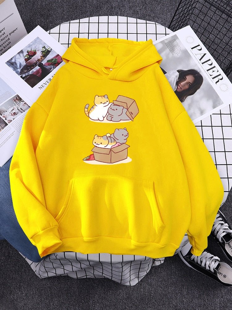 a bright yellow hoodie with pictures of happy cats playing and chilling in a box