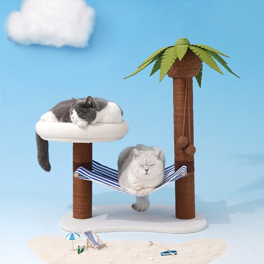 2 cats chilling on a swing cat bed that looks like hammock at a beach