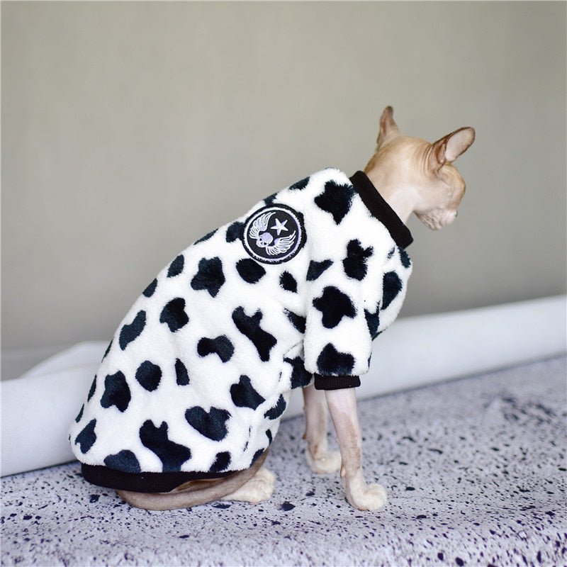 a cute cat clothing with cow pattern