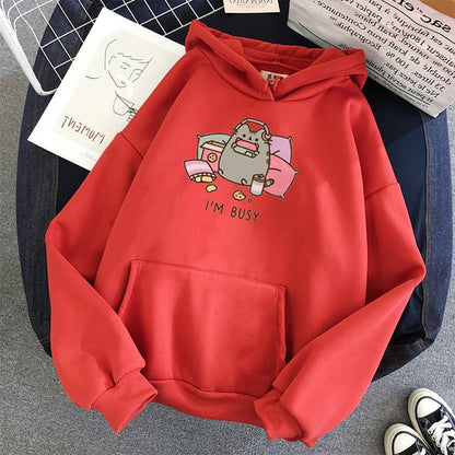 red color cute cat themed hoodie featuring a busy cat playing switch and listening to music
