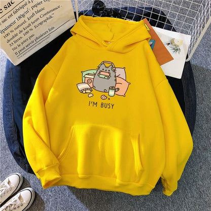 yellow color cat hoodie inspired by pusheen showing a busy cat playing switch console