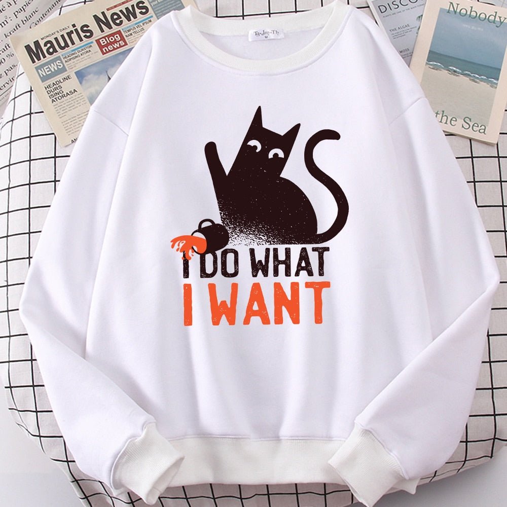 a white cat lover sweatshirt with a picture of a black cat pushing away a mug full of water