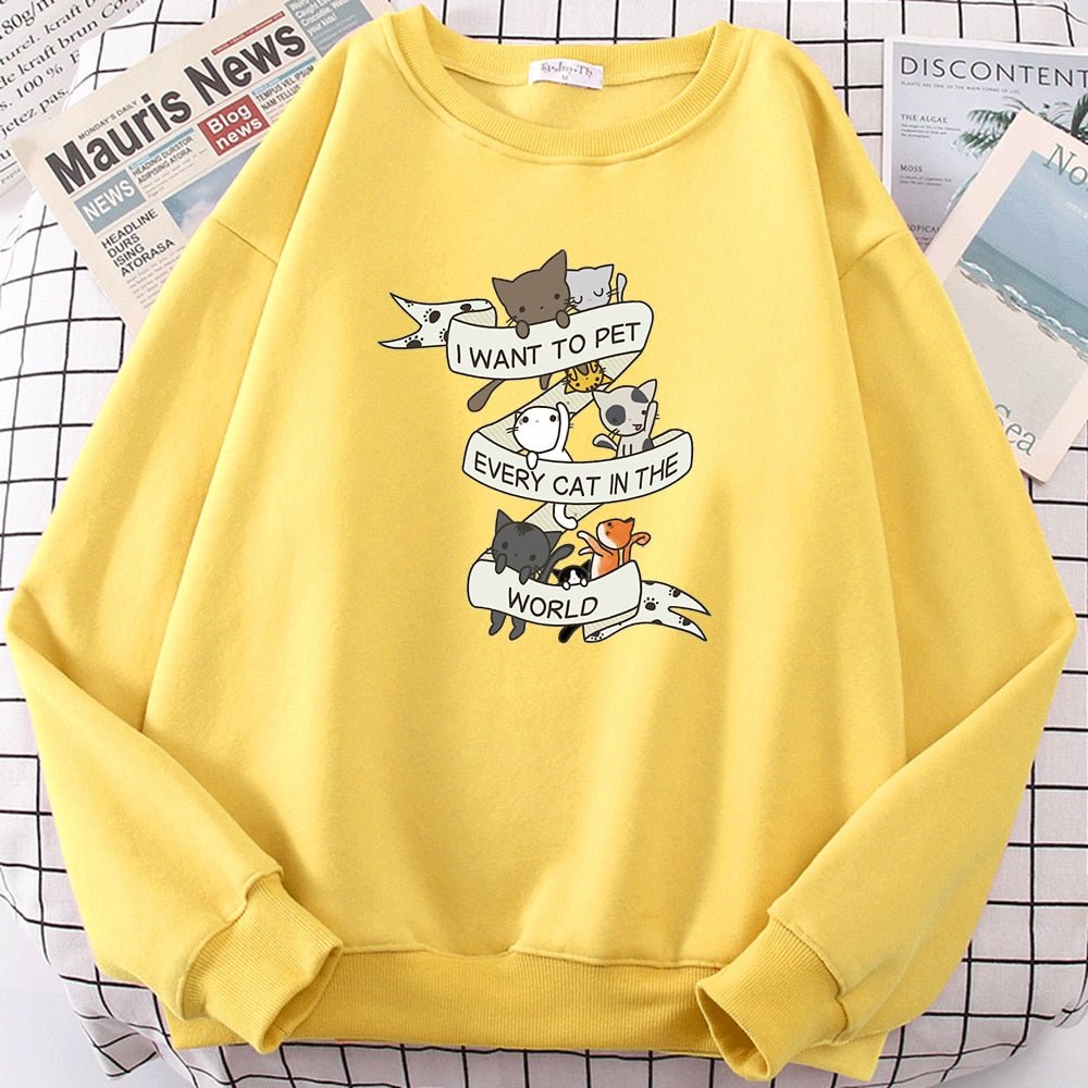 a yellow cat sweatshirt with the word I want to pet every cat in the world