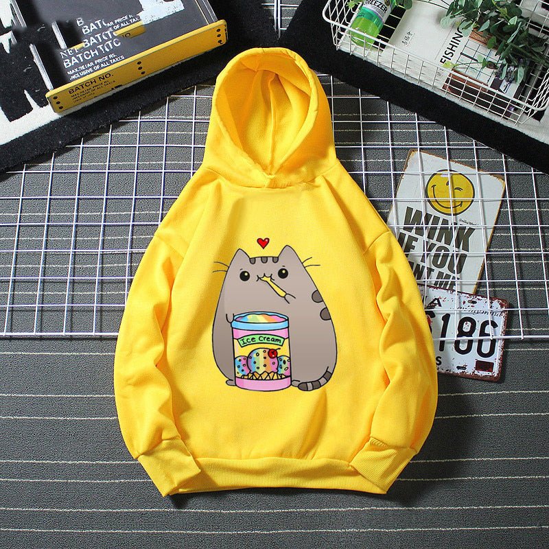 yellow color cat hoodie for kids showing a cat eating ice cream