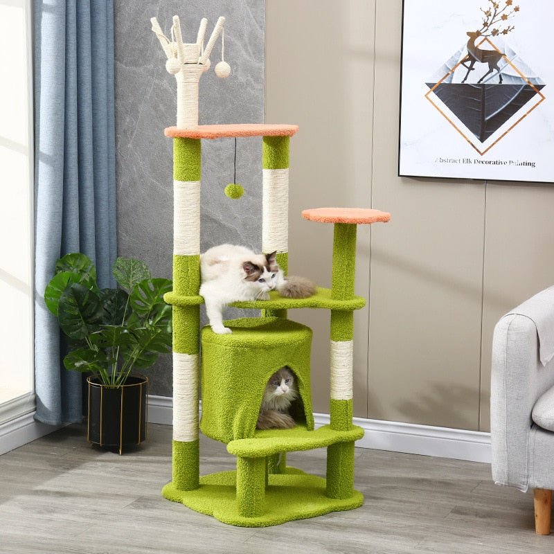 a green cat tower for adult cats with interactive toys