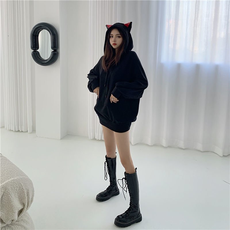a harajuku style lady wearing a japanese style black color hoodie with red cat ears and look really cool